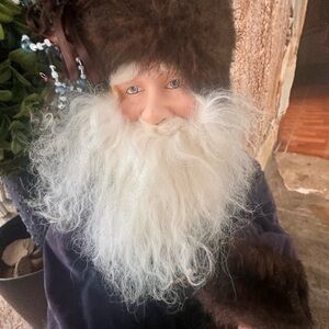 Whimsical Santa Figurine with Blue Coat
